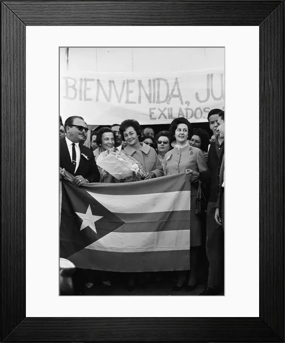 Framed Print : Juana Castro Holding Flowers Behind Cuban Flag Framed Print : Juana Castro Holding Flowers Behind Cuban Flag