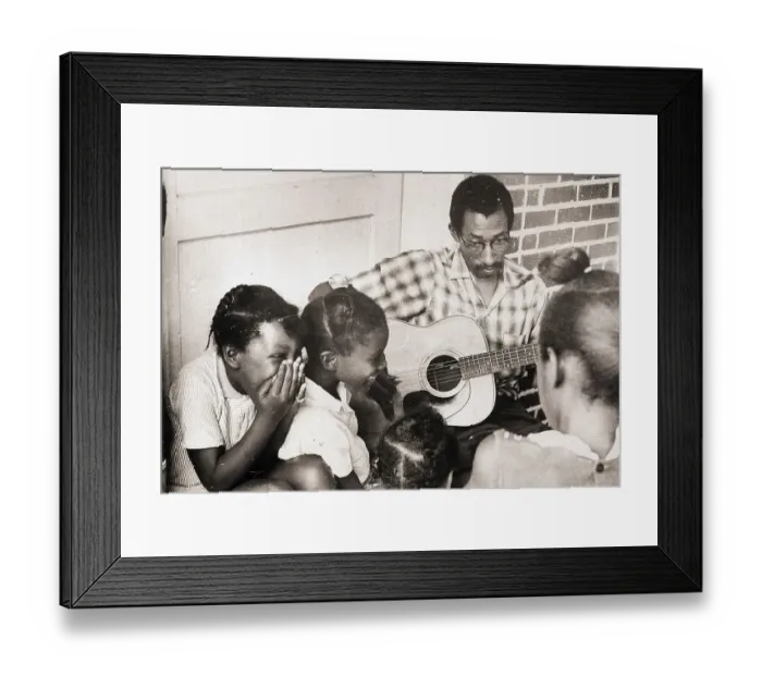 Framed Print : Man Plays Guitar for Laughing Girls Framed Print : Man Plays Guitar for Laughing Girls