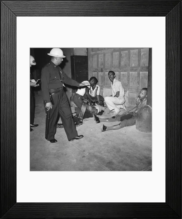 Framed Print : Injured Protesters Guarded by Police Officer Framed Print : Injured Protesters Guarded by Police Officer