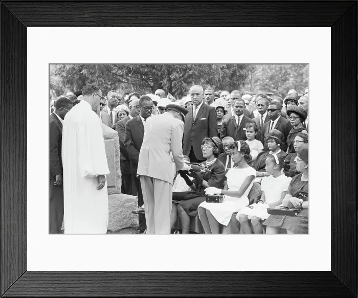 Framed Print : Officer Hands Folded Flag To Widow