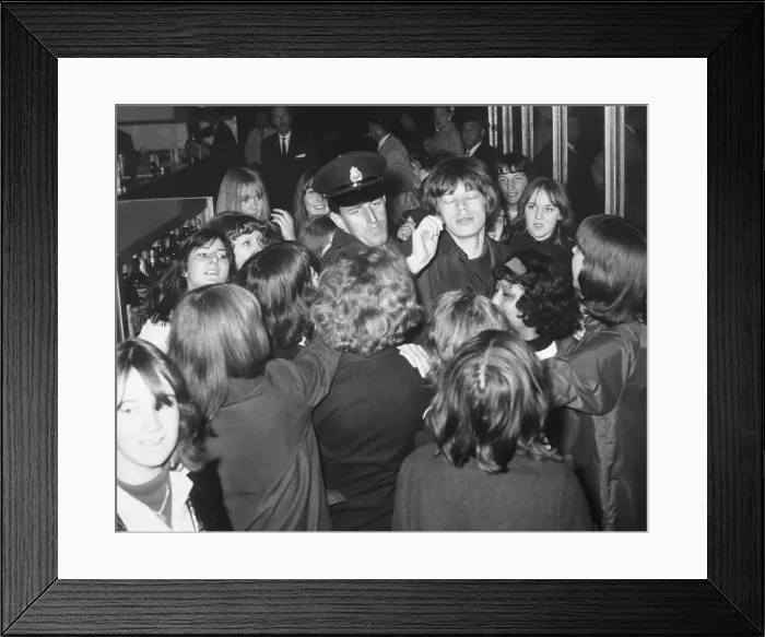 Framed Print : Mick Jagger Surrounded by Fans and Police Framed Print : Mick Jagger Surrounded by Fans and Police