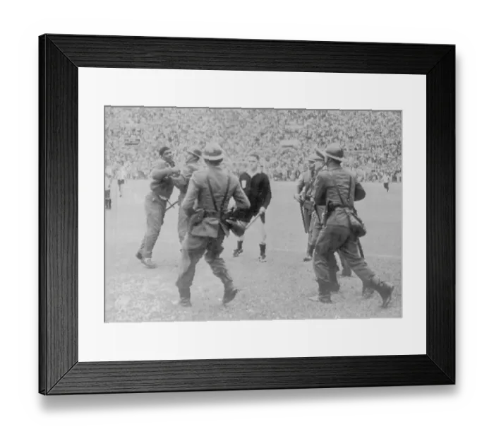 Framed Print : Police Restraining Man During Soccer Game Framed Print : Police Restraining Man During Soccer Game
