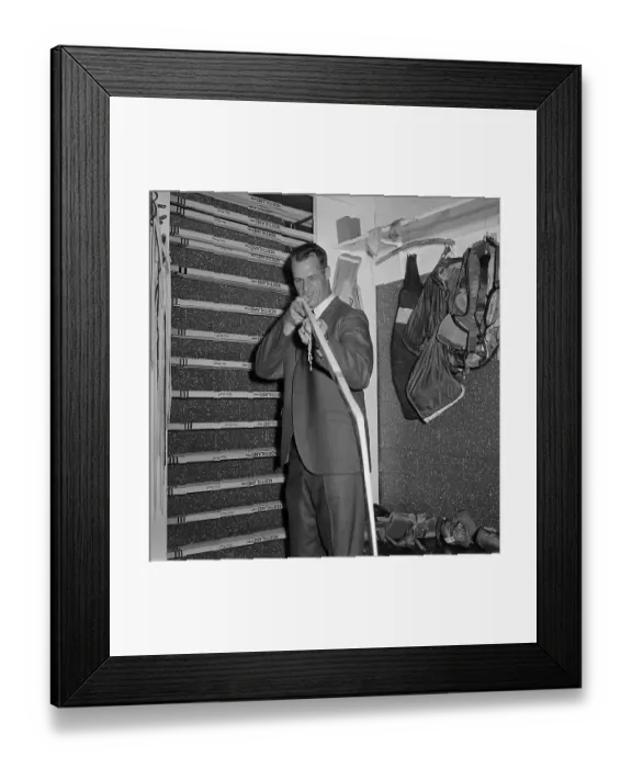 Framed Print : Gordon Howe Looks Down Shaft of Hockey Stick Framed Print : Gordon Howe Looks Down Shaft of Hockey Stick