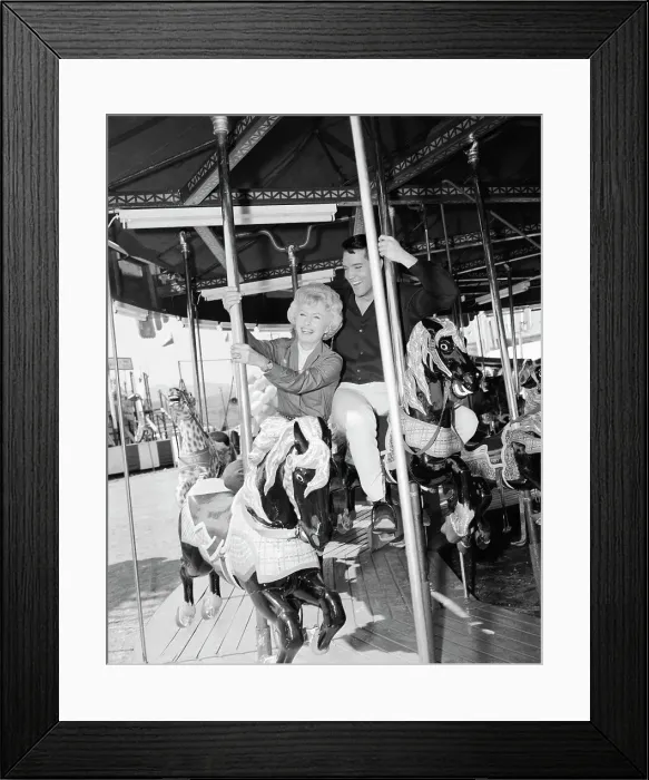 Framed Print : Barbara Stanwyck and Elvis Presley on a Carousel Framed Print : Barbara Stanwyck and Elvis Presley on a Carousel