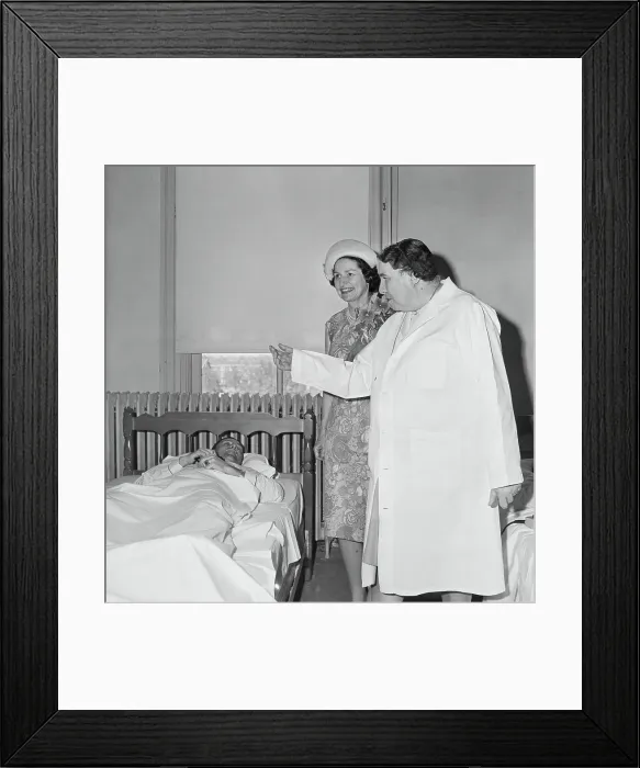Framed Print : Lady Bird Johnson Speaking to a Bedridden Man Framed Print : Lady Bird Johnson Speaking to a Bedridden Man