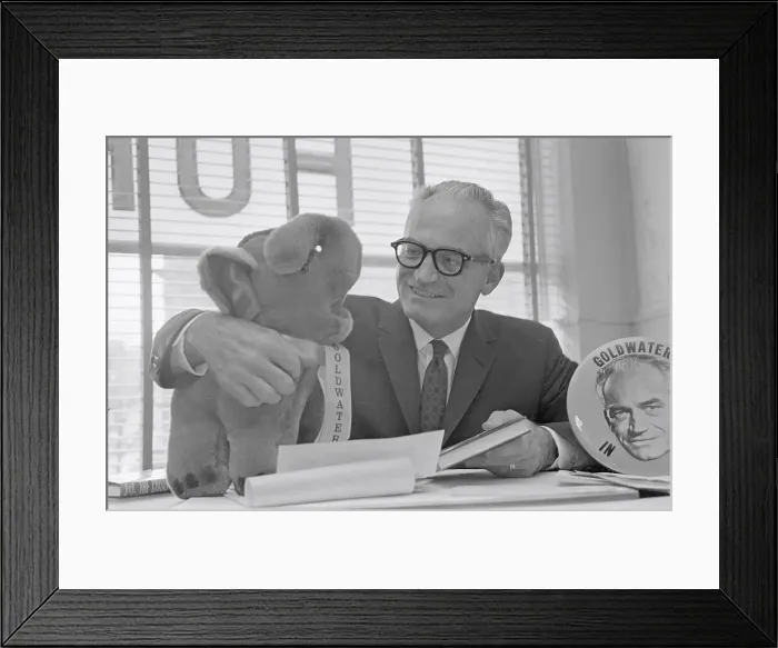 Framed Print : Senator Barry Goldwater Cuddling a Stuffed Elephant Framed Print : Senator Barry Goldwater Cuddling a Stuffed Elephant