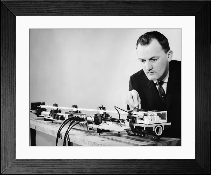 Framed Print : Scientist Demonstrating Gas Laser Framed Print : Scientist Demonstrating Gas Laser