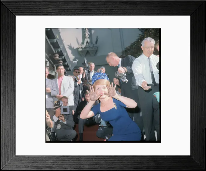 Framed Print : Debbie Reynolds Showing Cement-Covered Hands Framed Print : Debbie Reynolds Showing Cement-Covered Hands
