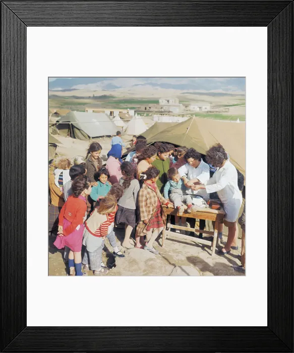 Framed Print : Doctors Treating Child at Turkish Refugee Camp Framed Print : Doctors Treating Child at Turkish Refugee Camp
