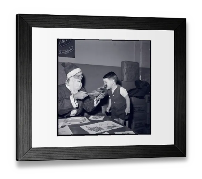Framed Print : Santa and Boy Eating Turkey Leg