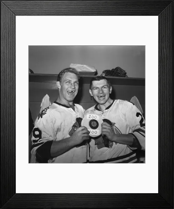 Framed Print : Hockey Players With Puck in Locker Room Framed Print : Hockey Players With Puck in Locker Room
