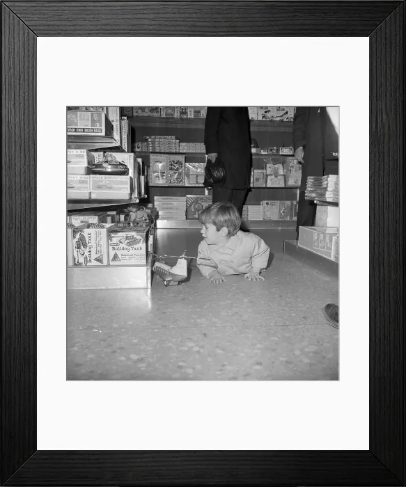 Framed Print : John Kennedy Jr. Playing with a Helicopter Framed Print : John Kennedy Jr. Playing with a Helicopter