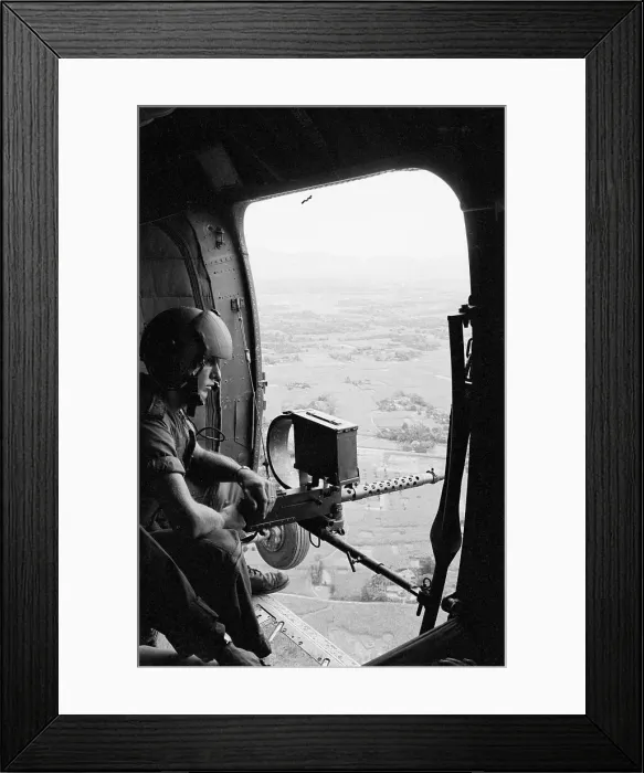 Framed Print : Machine Gunner in Helicopter Over Vietnam