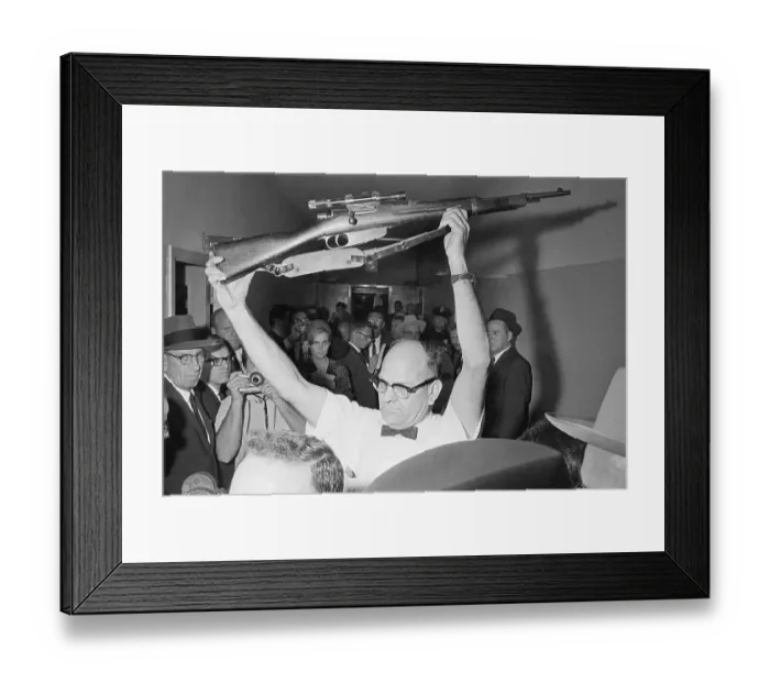 Framed Print : Policeman Holding Rifle Used in Kennedy Assassination Framed Print : Policeman Holding Rifle Used in Kennedy Assassination