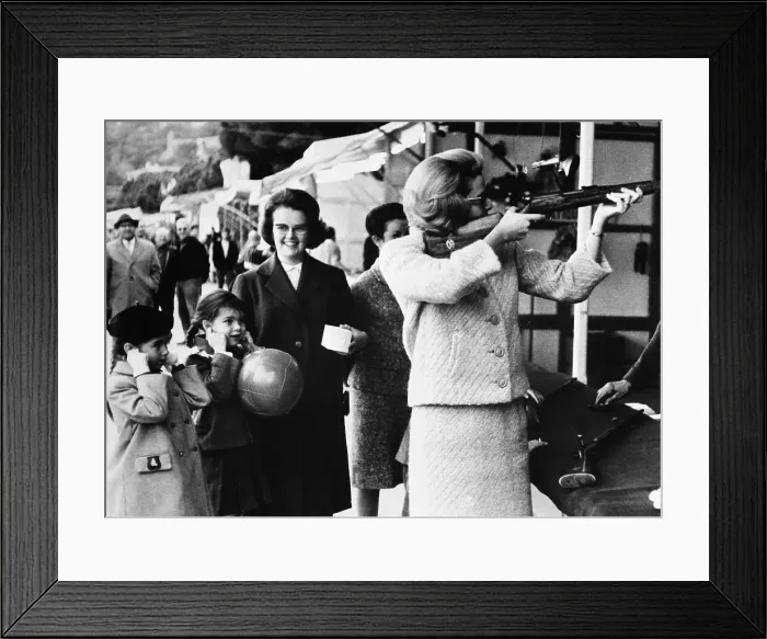 Framed Print : Grace Kelly Aiming Rifle with Princess Caroline Framed Print : Grace Kelly Aiming Rifle with Princess Caroline