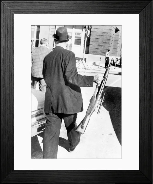 Framed Print : Detective Carries President Kennedy Murder Weapon Framed Print : Detective Carries President Kennedy Murder Weapon