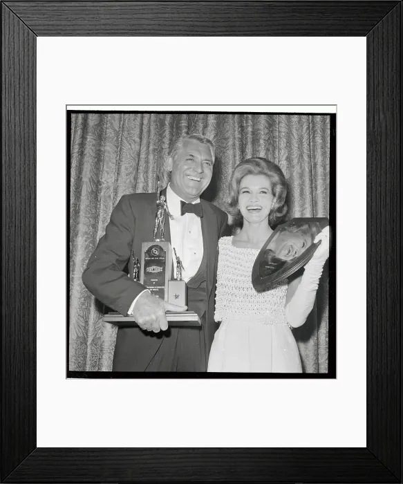 Framed Print : Cary Grant and Angie Dickinson Holding Awards Framed Print : Cary Grant and Angie Dickinson Holding Awards