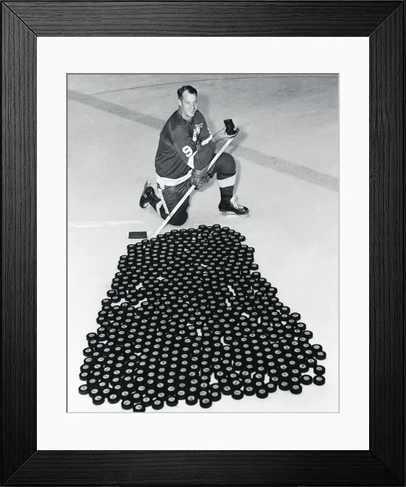 Framed Print : Gordon Howe on Ice With Hundreds of Pucks