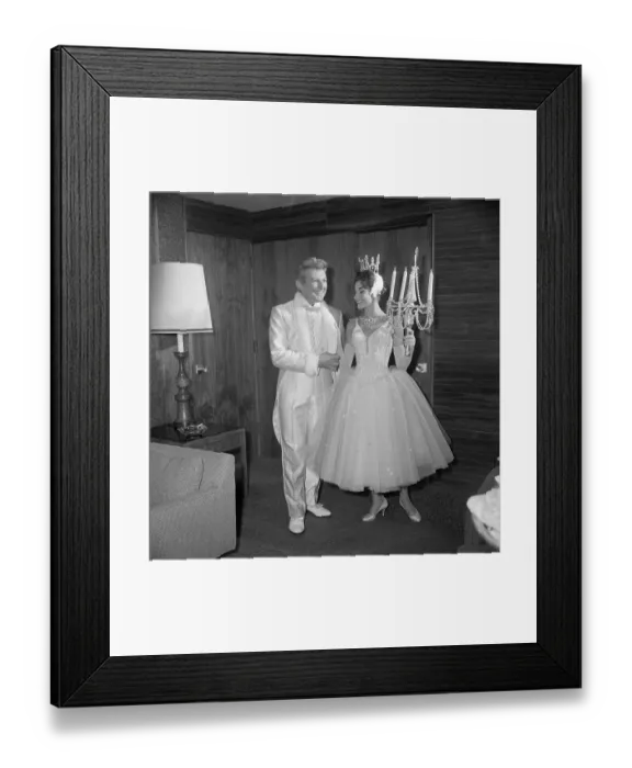 Framed Print : Liberace. Vikki Drue, a dancer, admires Liberace's all-white dinner suit Framed Print : Liberace. Vikki Drue, a dancer, admires Liberace's all-white dinner suit