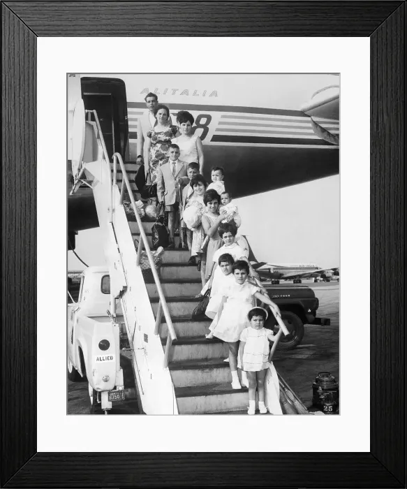Framed Print : Large Family Stepping off an Airplane Framed Print : Large Family Stepping off an Airplane