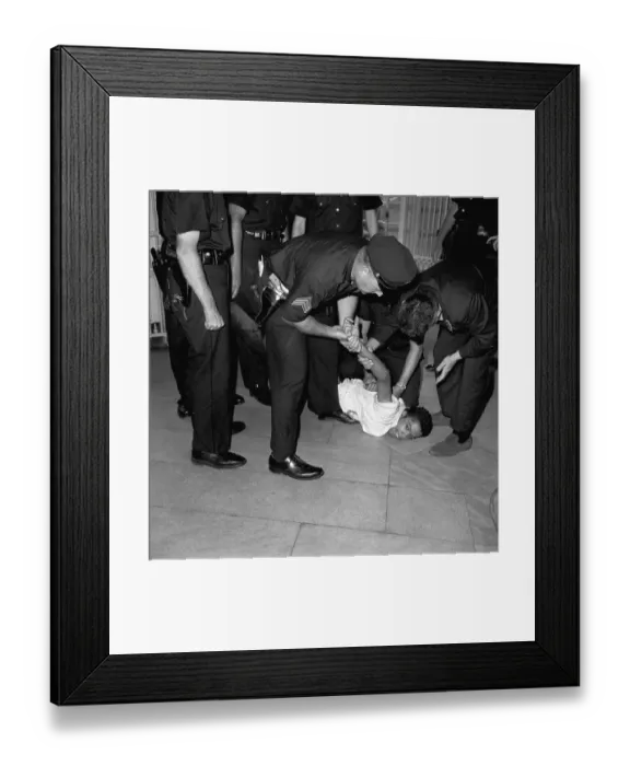 Framed Print : Police Struggle With Black Man On Ground Framed Print : Police Struggle With Black Man On Ground