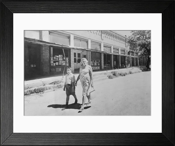 Framed Print : Atheist Walking Down Street with Her Son Framed Print : Atheist Walking Down Street with Her Son