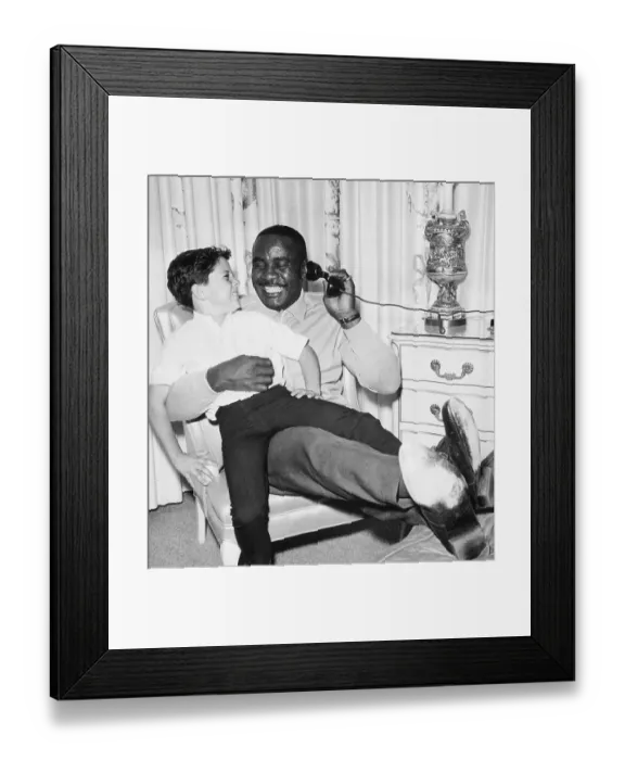 Framed Print : Sonny Liston On Phone W / Child On Lap Framed Print : Sonny Liston On Phone W / Child On Lap