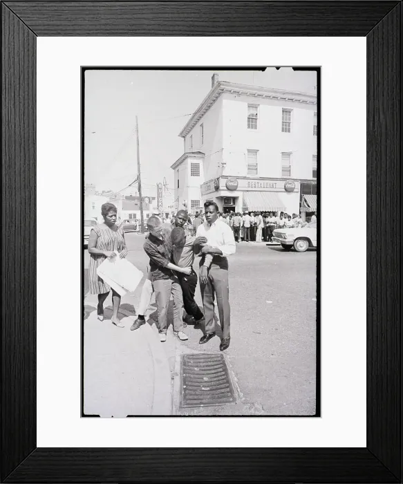Framed Print : Black Demonstrator Is Carried Away Framed Print : Black Demonstrator Is Carried Away