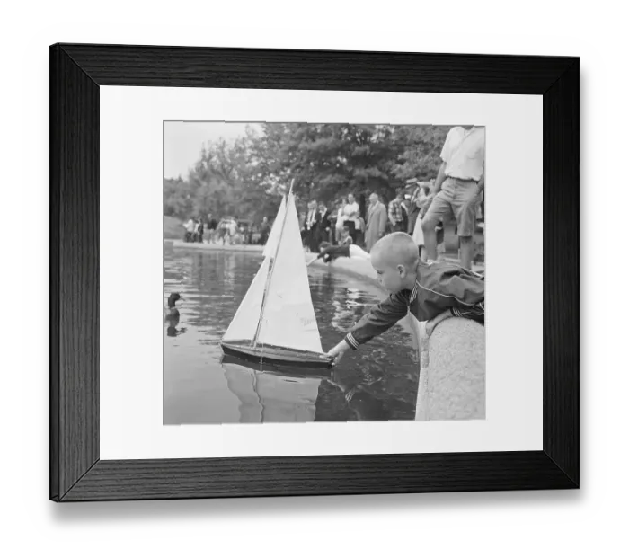 Framed Print : Child Playing With Model Boat At Park Framed Print : Child Playing With Model Boat At Park