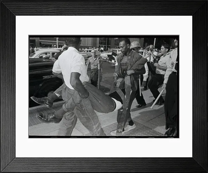 Framed Print : Man Being Carried by Two Officers Framed Print : Man Being Carried by Two Officers