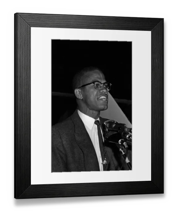 Framed Print : Malcolm X. Black Muslim minister Malcolm X has assistant hold picture of Framed Print : Malcolm X. Black Muslim minister Malcolm X has assistant hold picture of