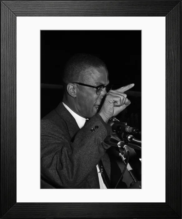 Framed Print : Malcolm X. Black Muslim minister Malcolm X has assistant hold picture of Framed Print : Malcolm X. Black Muslim minister Malcolm X has assistant hold picture of