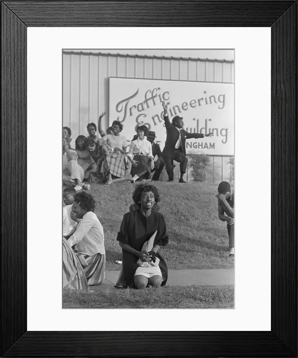 Framed Print : Demonstrator Kneeling in Prayer