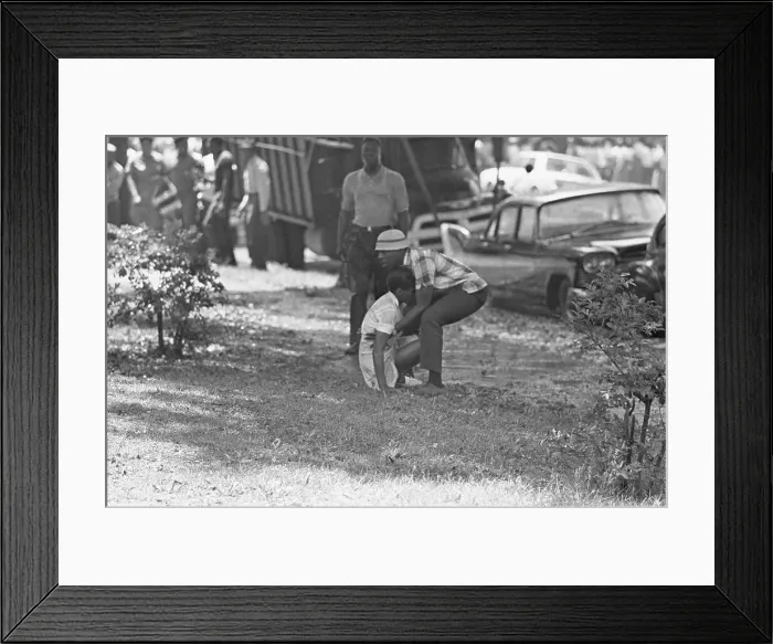 Framed Print : Woman Helped After Hose Attack