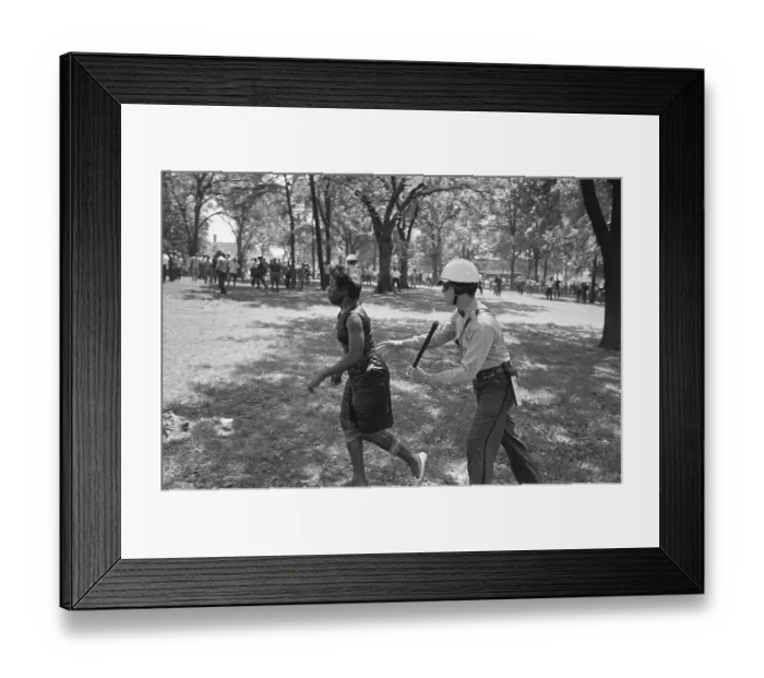Framed Print : Police Officer Chasing Female Protester Framed Print : Police Officer Chasing Female Protester