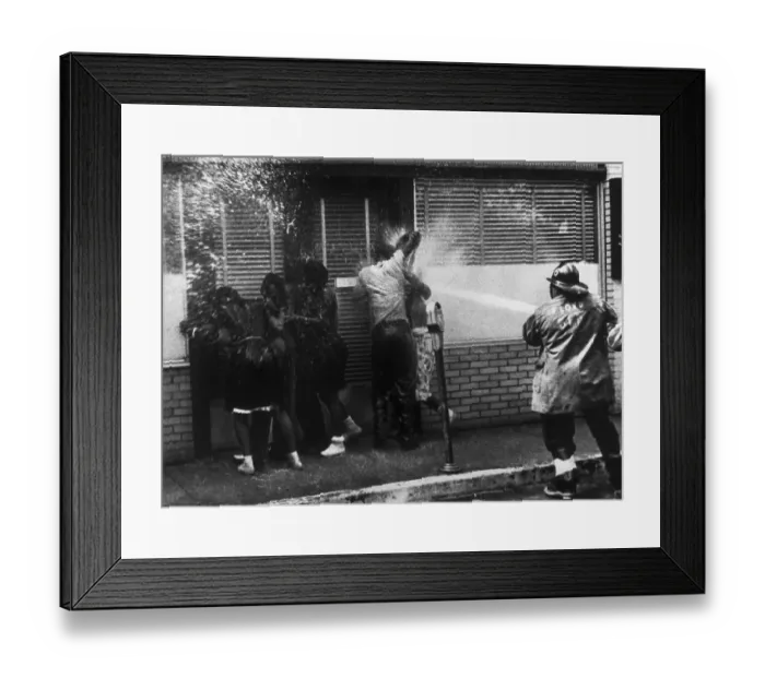Framed Print : Protesters Being Hosed by Fireman Framed Print : Protesters Being Hosed by Fireman