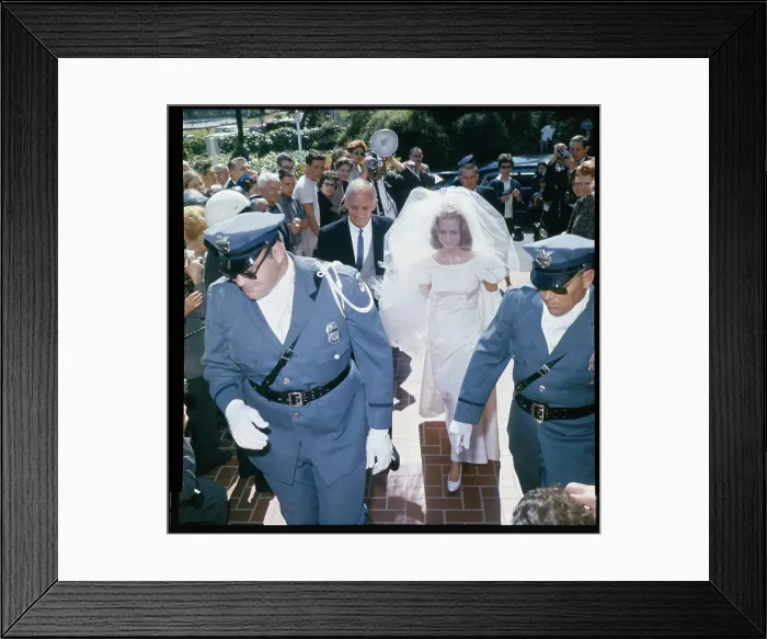 Framed Print : Policemen Escorting Tom and Kris Harmon Framed Print : Policemen Escorting Tom and Kris Harmon