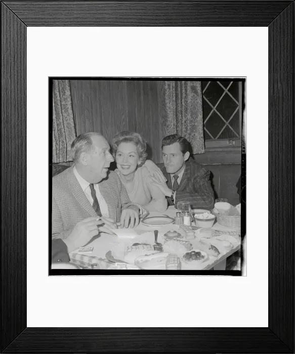 Framed Print : Maureen O'Sullivan Sitting at Table with Admirers Framed Print : Maureen O'Sullivan Sitting at Table with Admirers