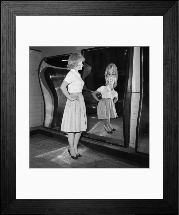 Framed Print : Woman Standing at Fun House Mirror