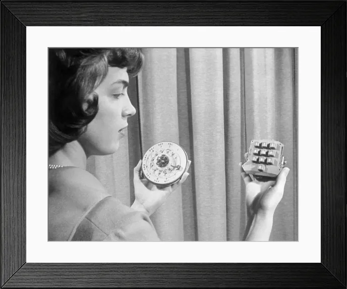 Framed Print : Woman Holding Pushbutton and Rotary Dialers