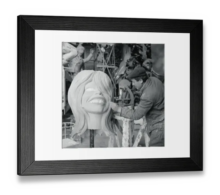 Framed Print : Artist Painting Papier Mache Head of Brigitte Bardot Framed Print : Artist Painting Papier Mache Head of Brigitte Bardot