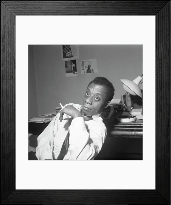 Framed Print : James Baldwin Sitting Smoking A Cigarette