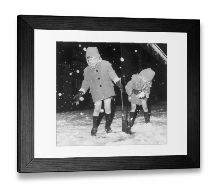 Framed Print : Twins Playing in Snowstorm in New York City Framed Print : Twins Playing in Snowstorm in New York City