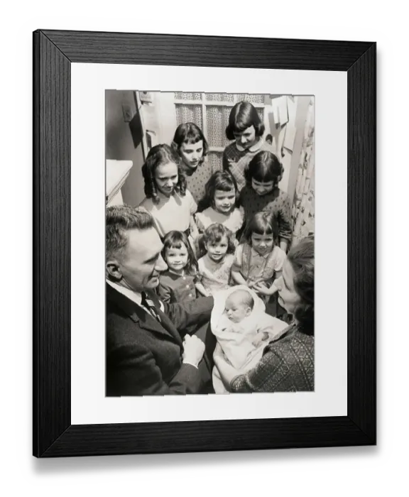 Framed Print : Parents with family of Girls Look at baby boy Framed Print : Parents with family of Girls Look at baby boy