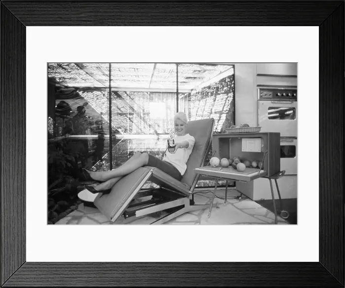 Framed Print : Model Demonstrating Remote-control Easy Chair Framed Print : Model Demonstrating Remote-control Easy Chair