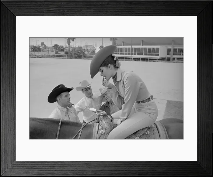 Framed Print : Rodeo Queen Applying Makeup with Mirror in Saddle Horn Framed Print : Rodeo Queen Applying Makeup with Mirror in Saddle Horn