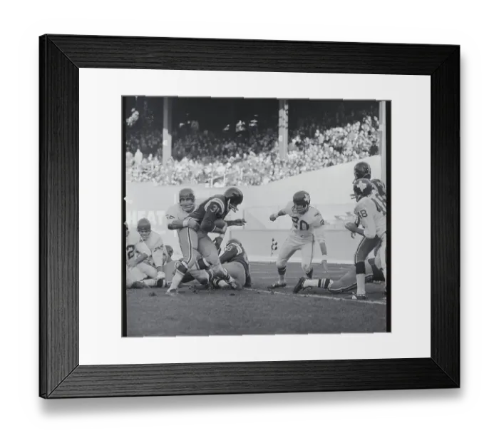 Framed Print : Football Player Tackling Opponent Framed Print : Football Player Tackling Opponent