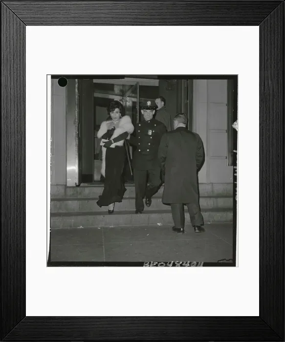 Framed Print : Policeman Leading a Man in Drag by the Arm Framed Print : Policeman Leading a Man in Drag by the Arm