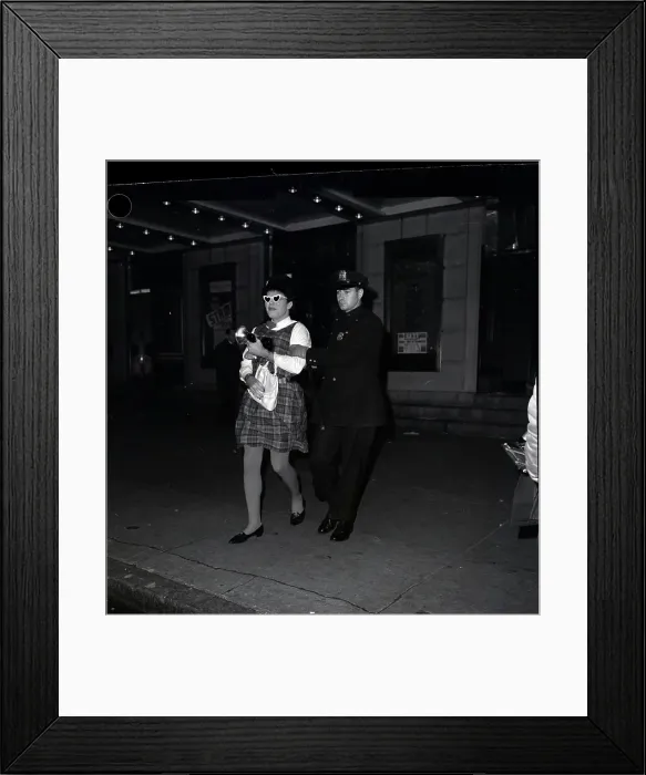Framed Print : Man Dressed As Woman Led Off By Policema Framed Print : Man Dressed As Woman Led Off By Policema