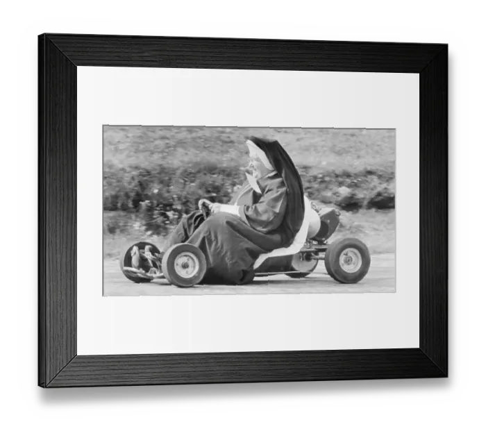 Framed Print : Nun Races Go-Cart